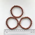 Guldsten - Rød Stjernesten Armbånd 7 mm Perler 17-19 cm