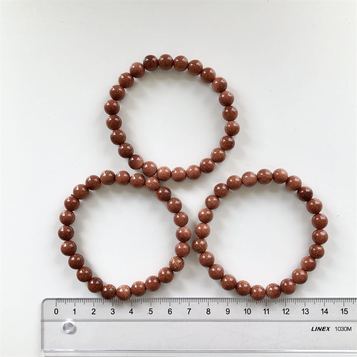 Guldsten - Rød Stjernesten Armbånd 7 mm Perler 17-19 cm